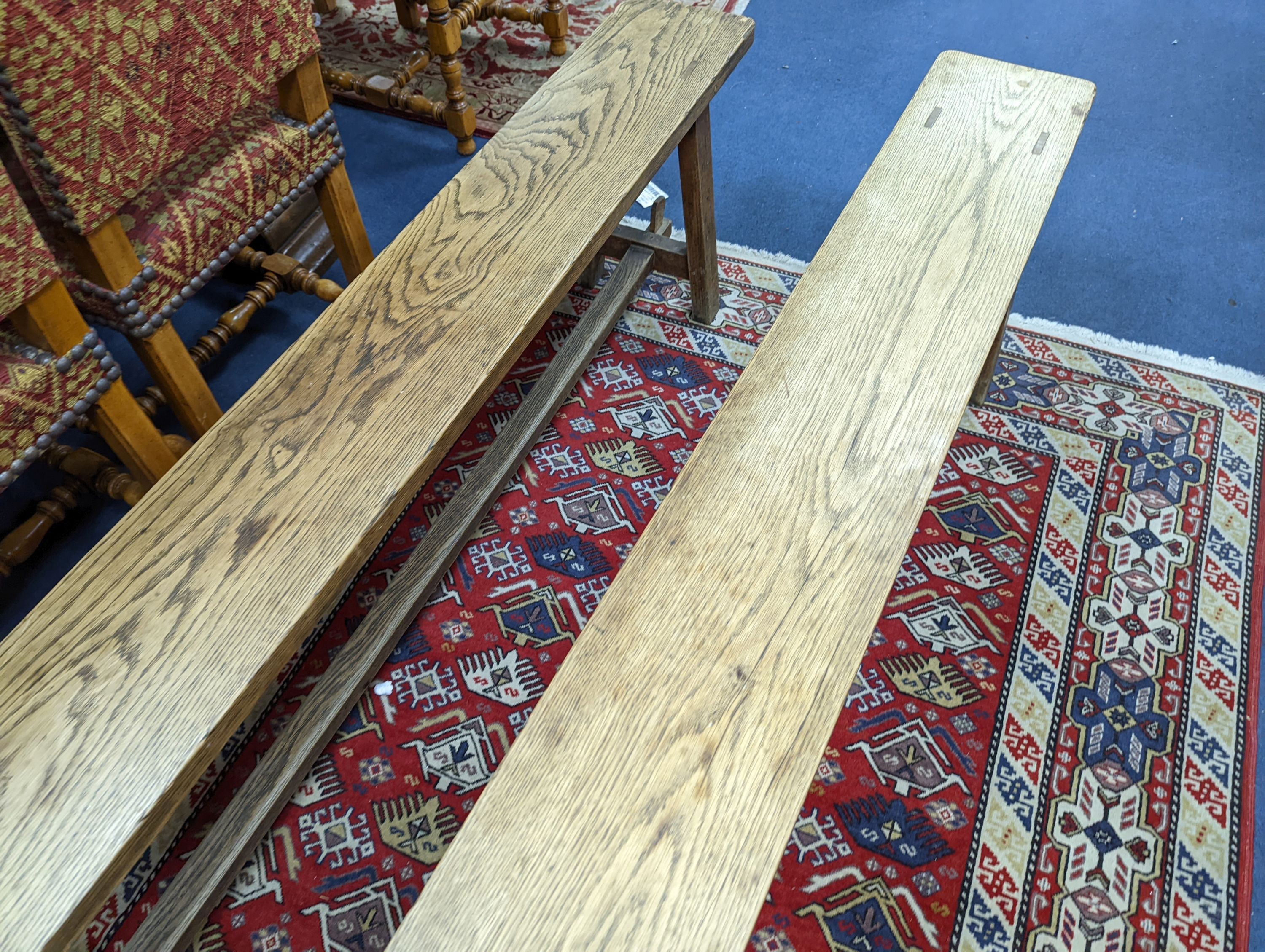 A pair of 19th century French provincial oak bench seats, length 170cm, depth 22cm, height 44cm
